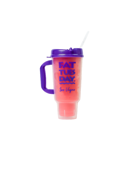 Pink frozen drink in cup with lid and handle